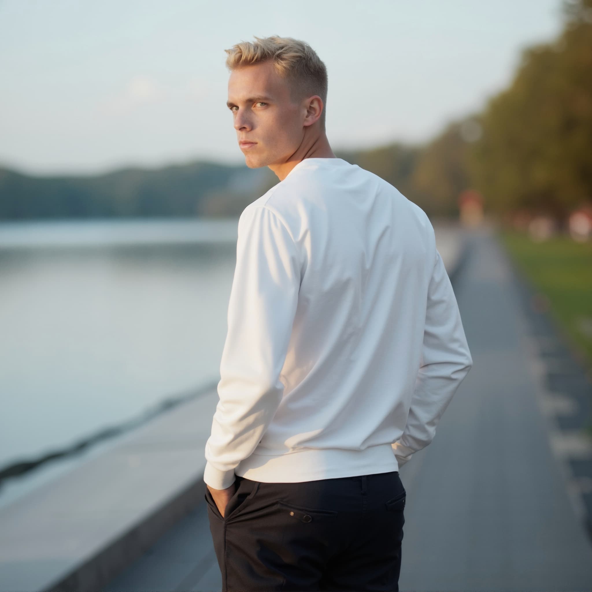 Back-View long sleeve sweatshirt mockup a man stands with hands in pockets by a lake